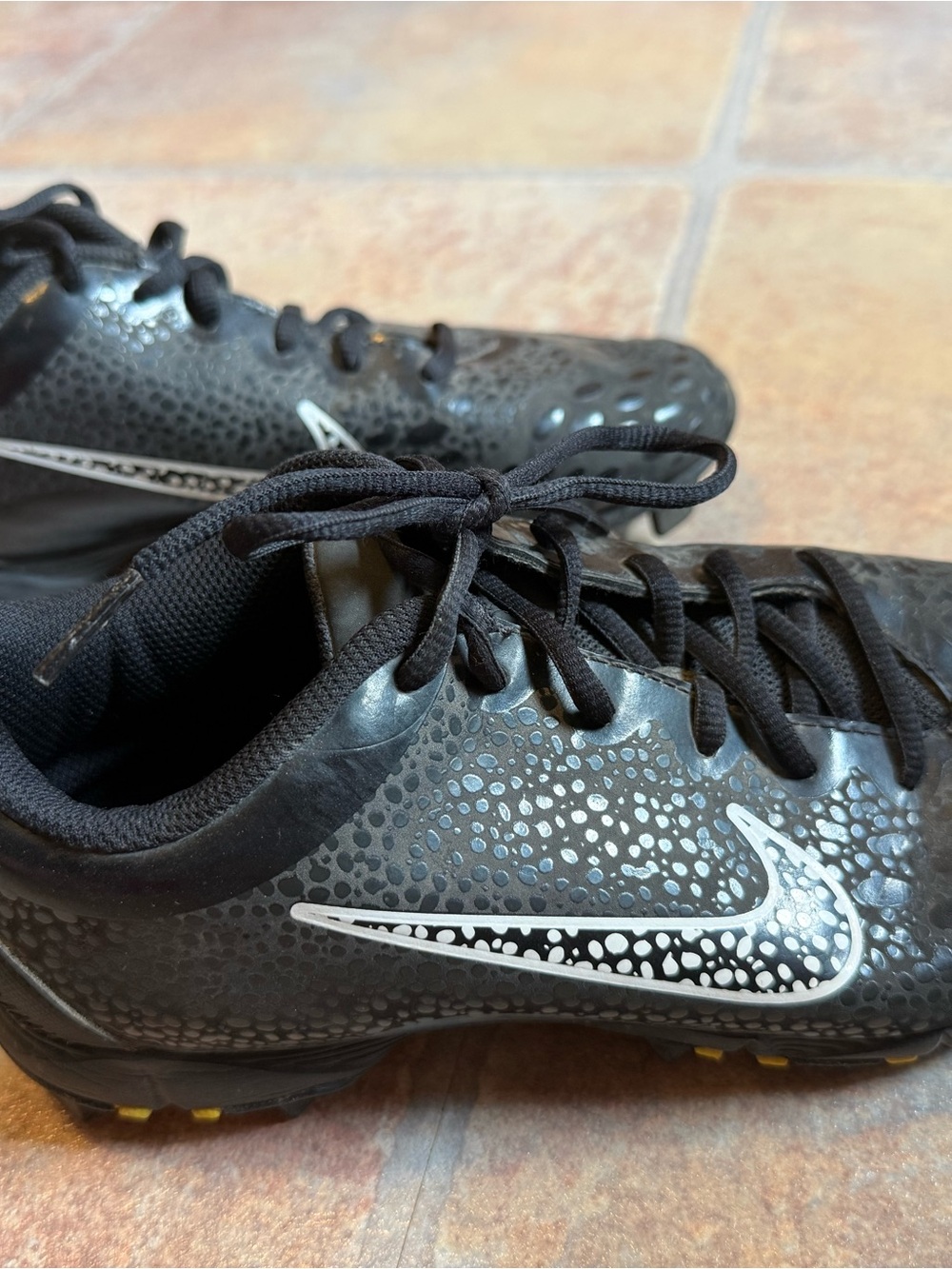 Nike Black Cleats with White Swoosh Accent